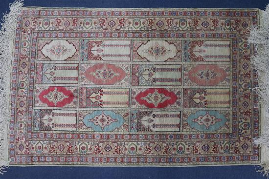 A Persian silk rug 113cm x 70cm